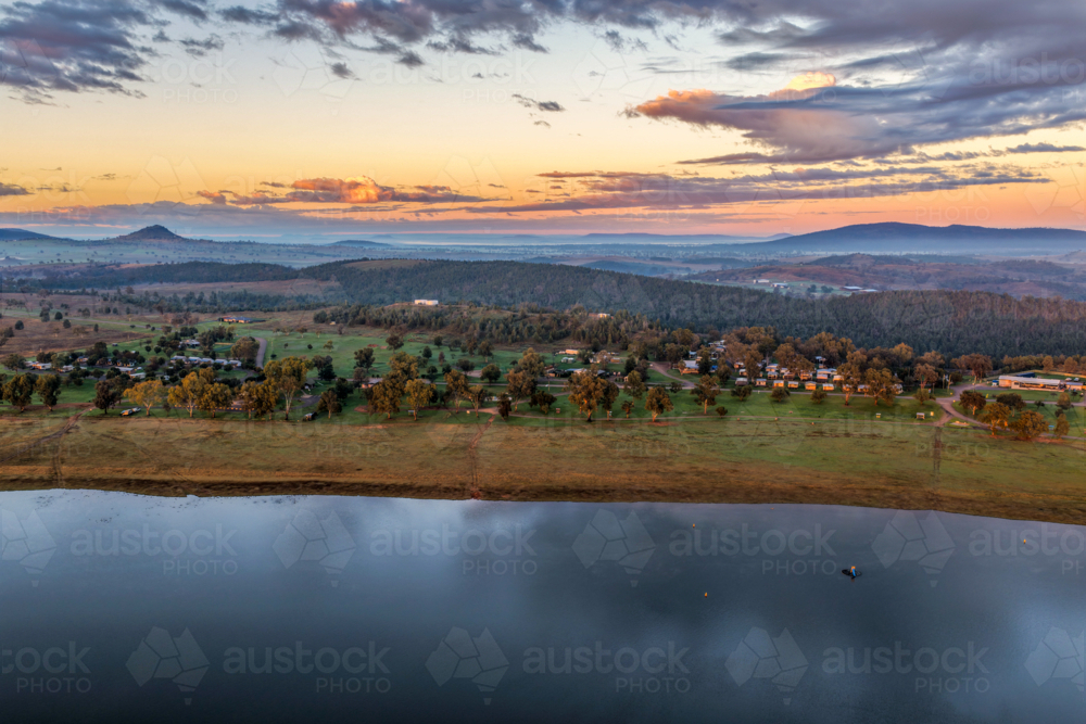 Aerial view at dawn over the expansive waters of Lake Keepit, with a foggy rural landscape. - Australian Stock Image