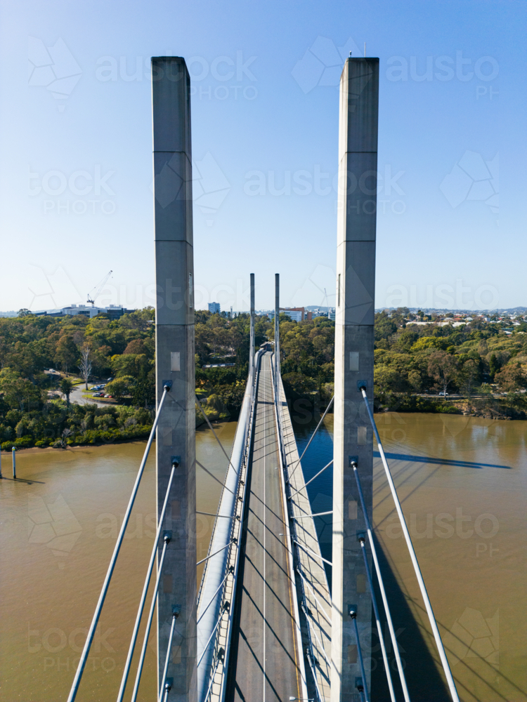 Aerial view between structural pylons of the Eleanor Schonell Bridge looking at the Brisbane River : Austockphoto Aerial view between structural pylons of the Eleanor Schonell Bridge looking at the Brisbane River - Australian Stock Image