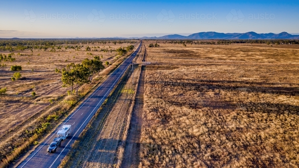 Aerial view caravan, bushland and highway of Mount Morgan during day time - Australian Stock Image