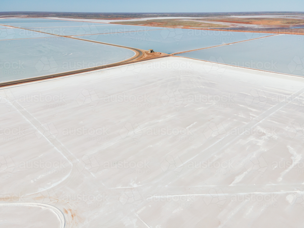 Aerial view image of blue and white Salt pans in Onslow WA - Australian Stock Image