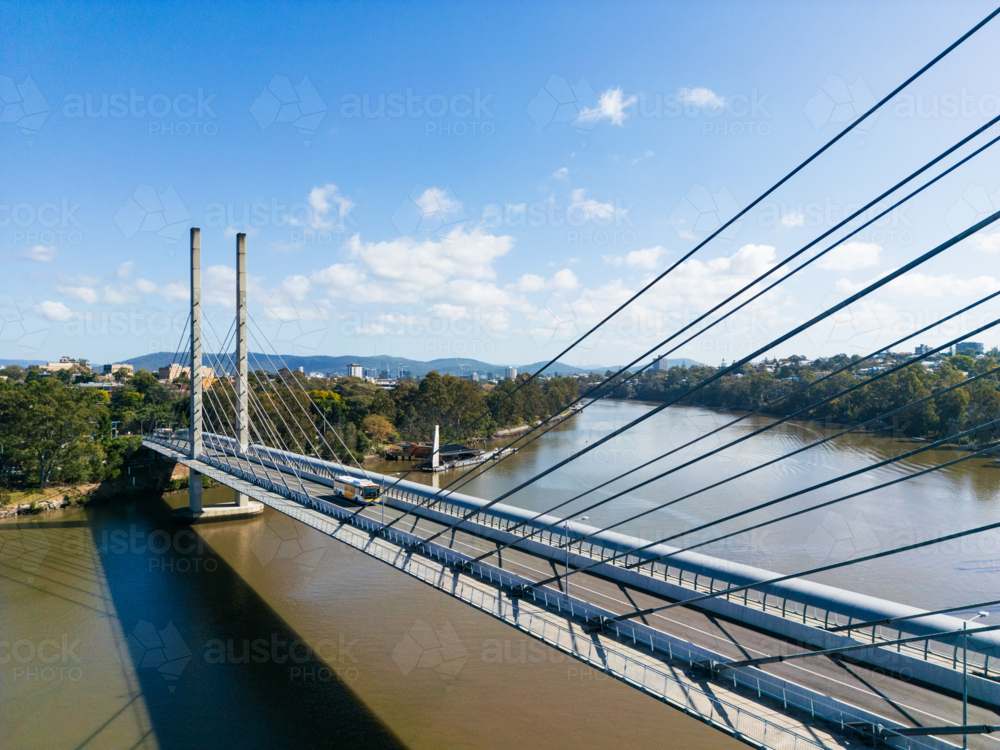 Aerial view looking across the Eleanor Schonell Bridge as a bus passes over - Australian Stock Image