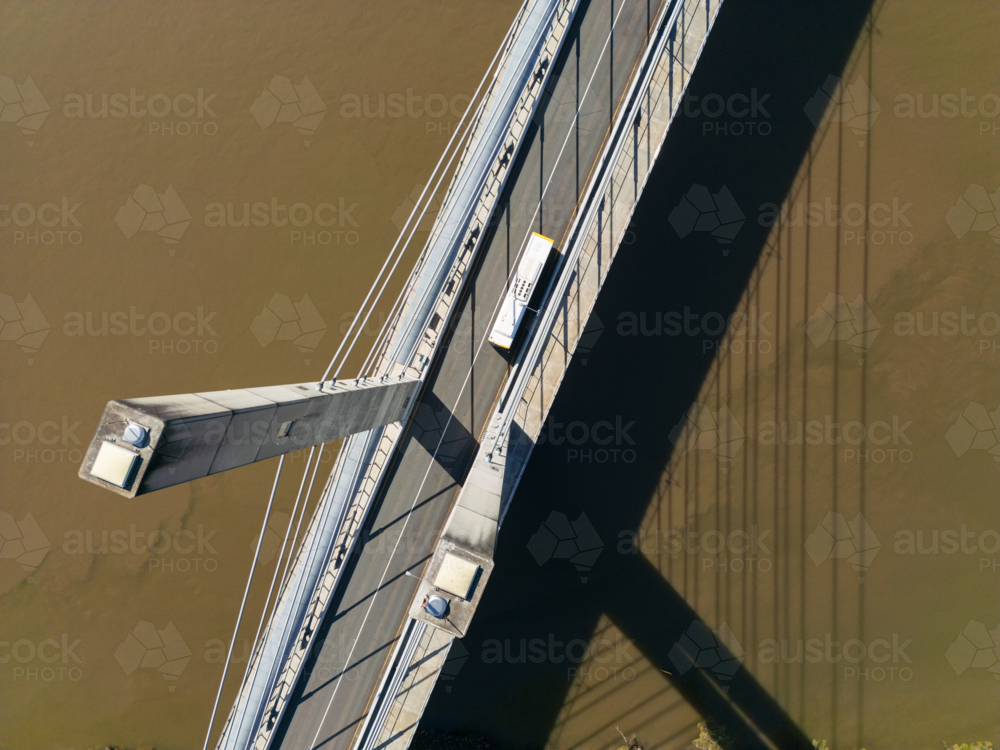 Aerial view looking down pylons at the surface of the the Eleanor Schonell Bridge - Australian Stock Image
