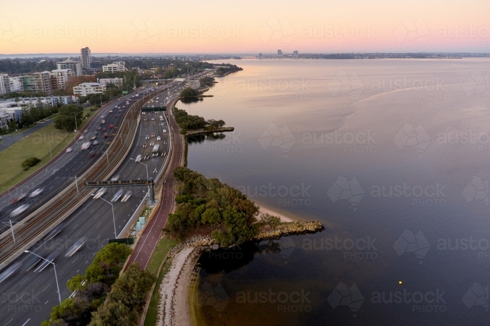 Aerial view looking down the Kwinana Freeway and Swan River at dawn in Perth, Australia. - Australian Stock Image