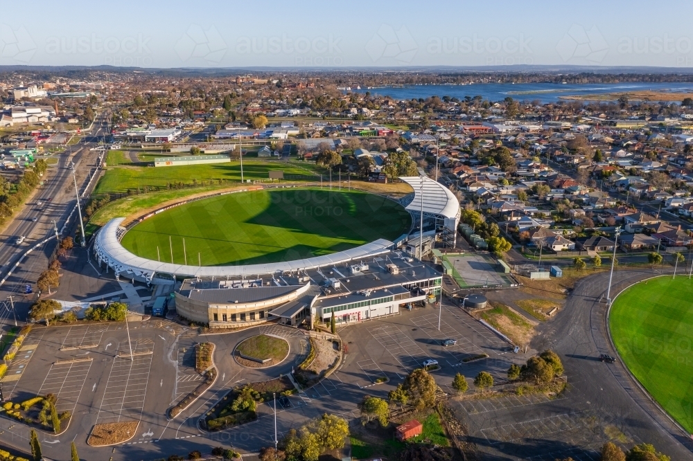 Aerial view of a AFL football stadium with surrounding vacant car park - Australian Stock Image