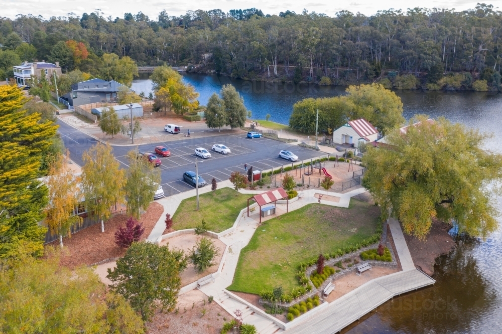 Aerial view of a barbecue area and ca rpark on the shore of a lake - Australian Stock Image