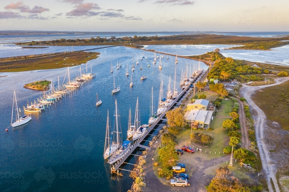 Image of Aerial view of a boats and yachts anchored at a coastal marina ...