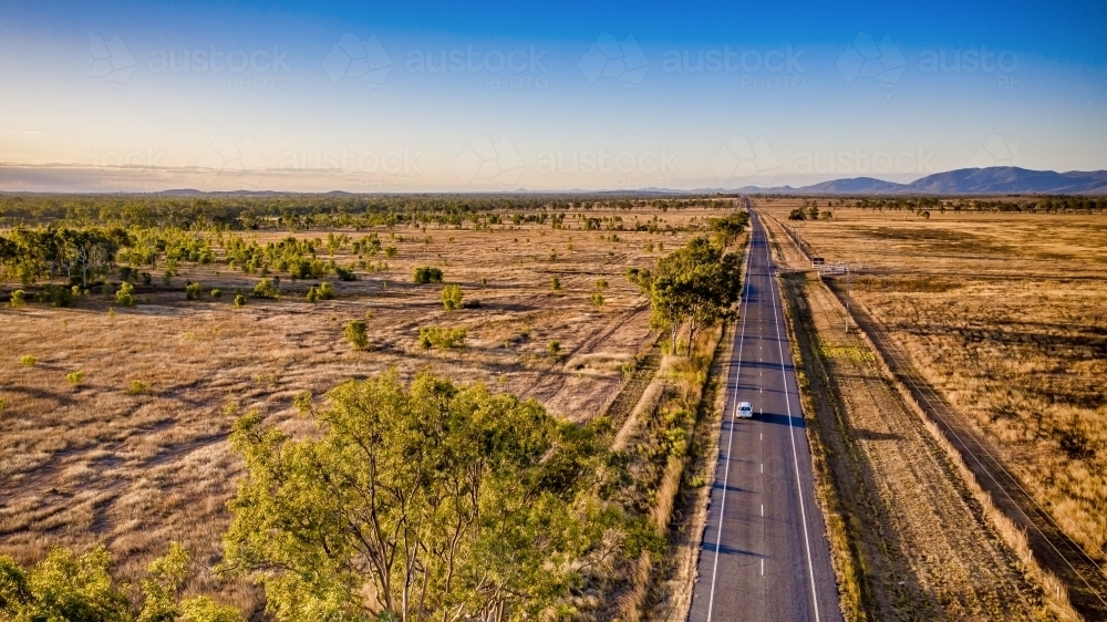 Aerial view of a bush land and highway of Mount Morgan during day time - Australian Stock Image