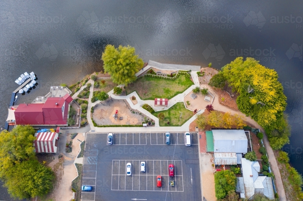 Aerial view of a cafe, car park and barbecue around the shores of a lake - Australian Stock Image