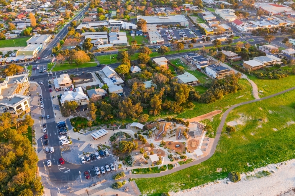 Aerial view of a car park with a playground and coastal reserve - Australian Stock Image