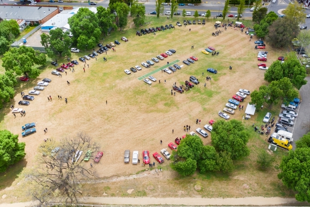 Aerial view of a car rally parked around a cricket oval - Australian Stock Image