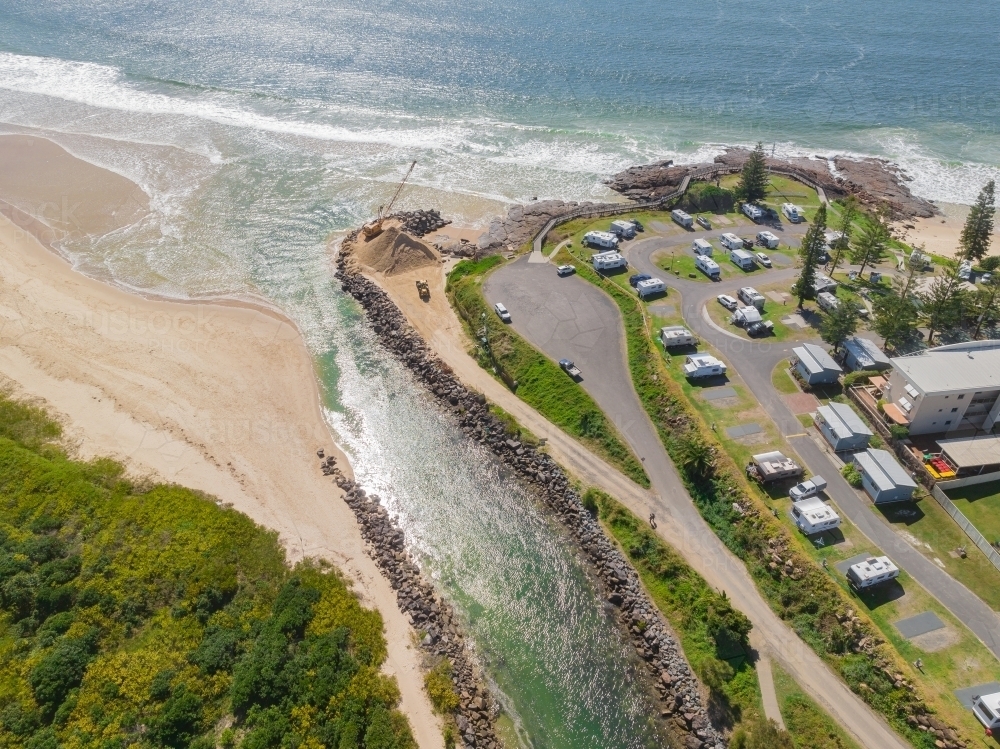 Caravan View Image of Aerial view of a caravan park between the ocean and a sandy ...