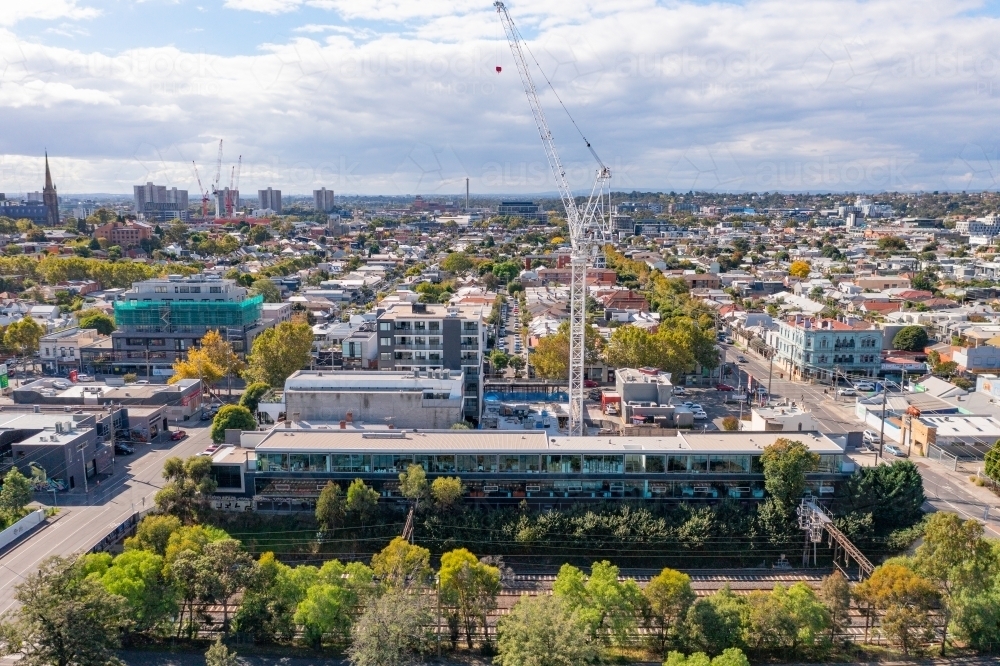 Aerial view of a city construction sight with a large crane - Australian Stock Image