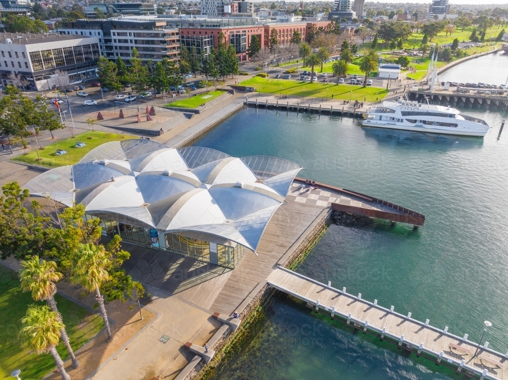 Image of Aerial view of a city waterfront with green parkland and ...