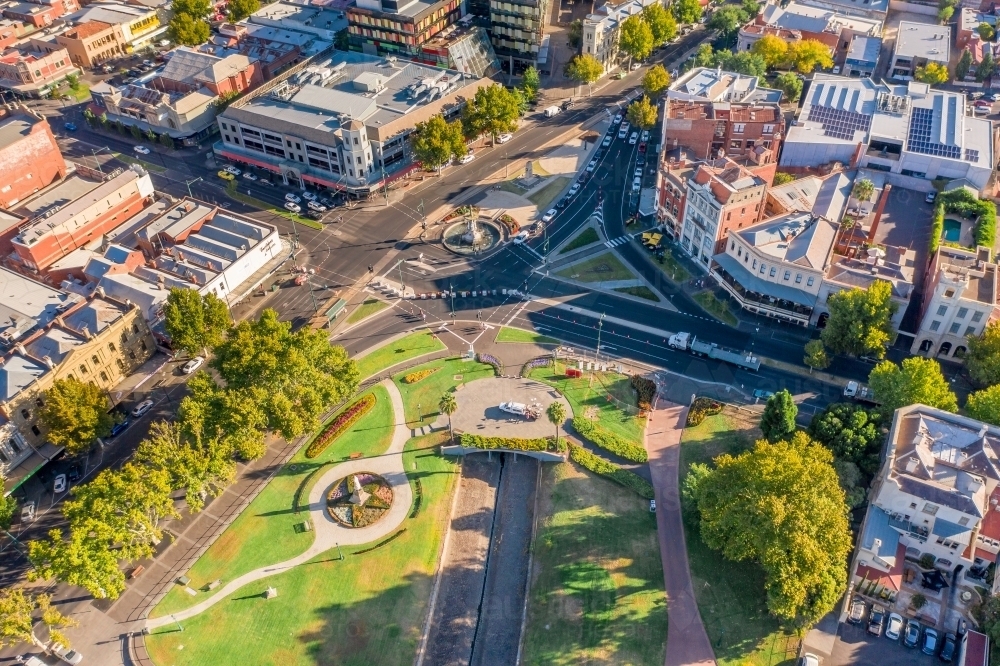 Aerial view of a city with a park near a busy intersection - Australian Stock Image