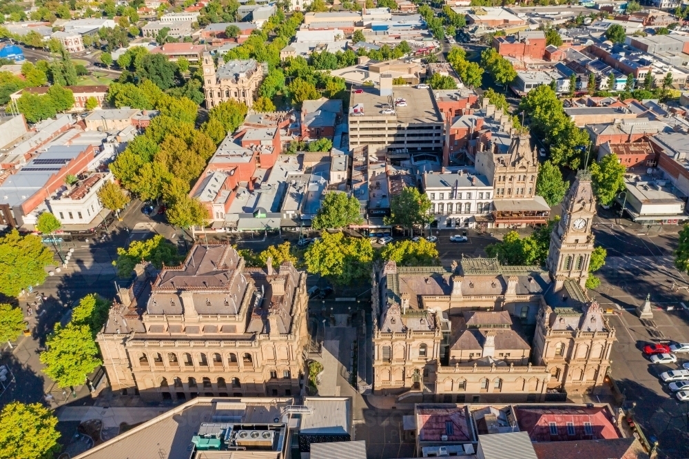 Aerial view of a city with historic buildings and tree lined streets - Australian Stock Image