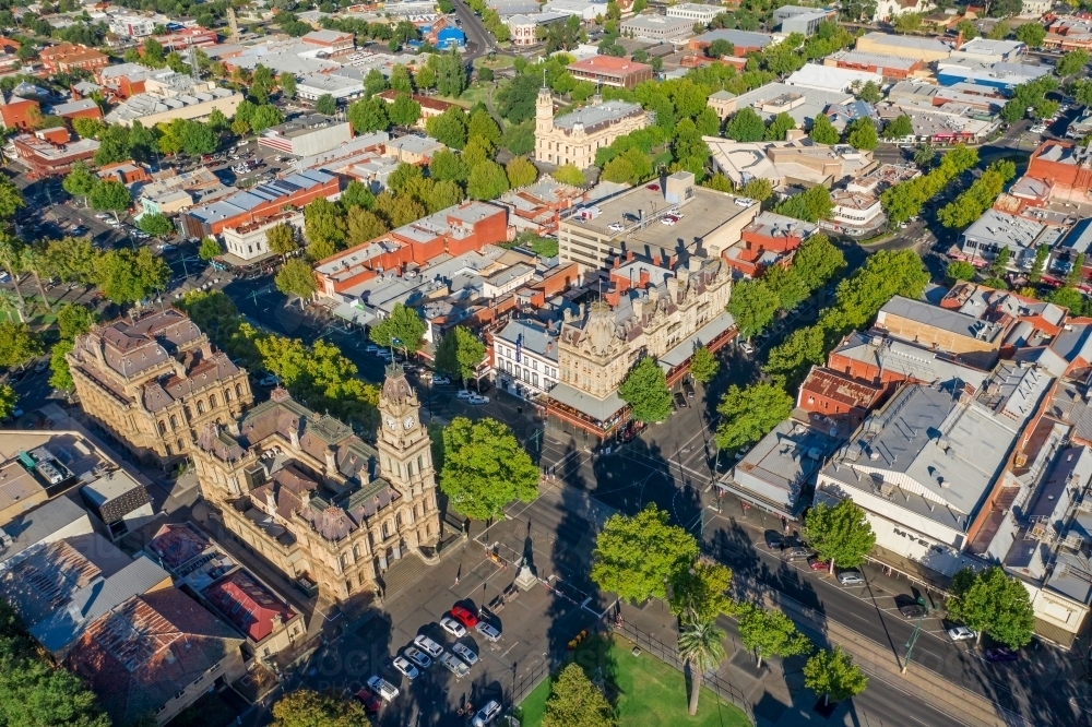 Aerial view of a city with historic buildings and tree lined streets - Australian Stock Image