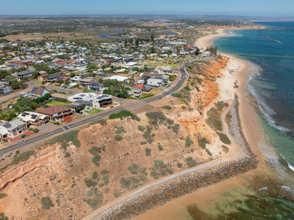 Aerial view of a coastal community on a cliff top above a rocky coastline - Australian Stock Image