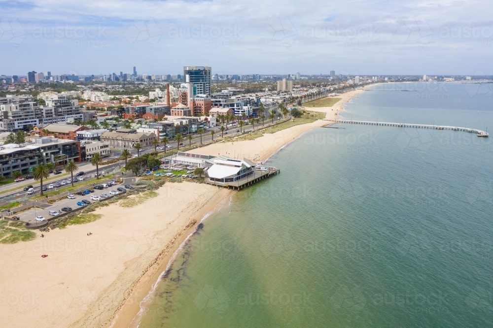 Aerial view of a coastal yacht club and pier along a beach - Australian Stock Image
