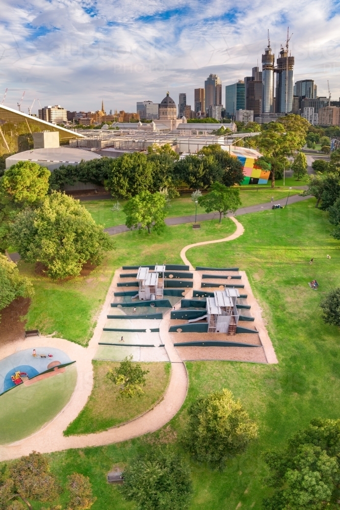 Aerial view of a garden path winding through children's playground in a inner city park - Australian Stock Image