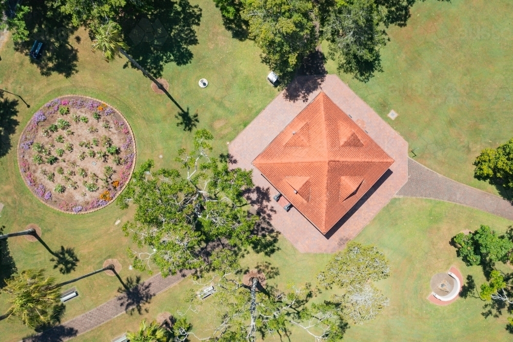 Aerial view of a gazebo and garden beds in a grassy park - Australian Stock Image