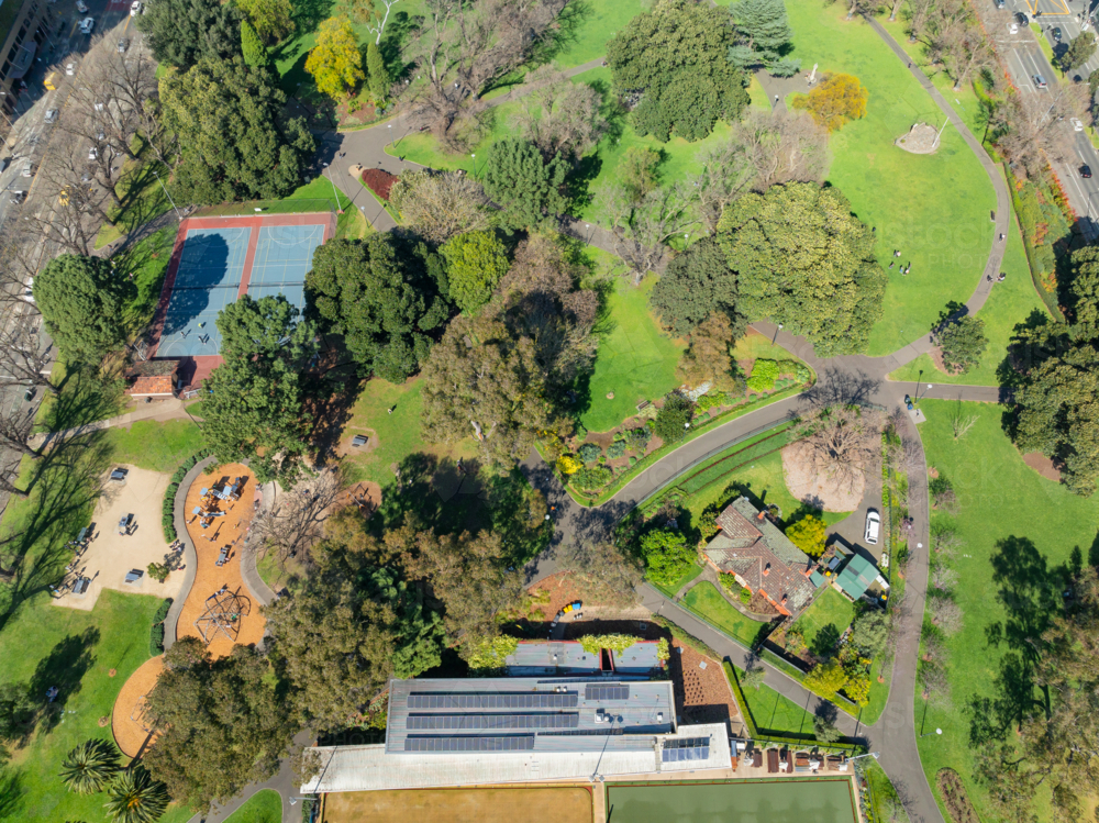 Image of Aerial view of a green inner city park with walking paths ...