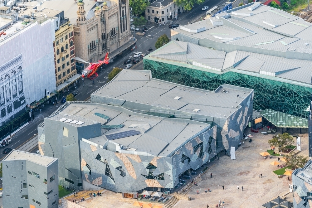 Aerial view of a helicopter flying over Federation Square in Melbourne - Australian Stock Image