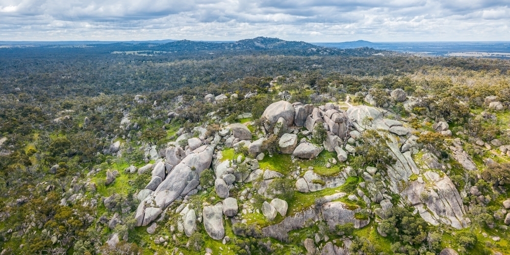 Image of Aerial view of a hilltop covered in large granite boulders