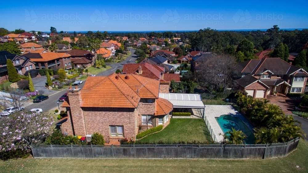 Aerial view of a home with pool in backyard. - Australian Stock Image