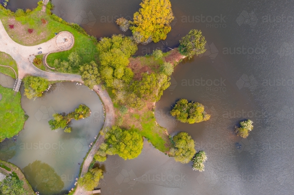 Aerial view of a lake shoreline with islands and walking tracks - Australian Stock Image