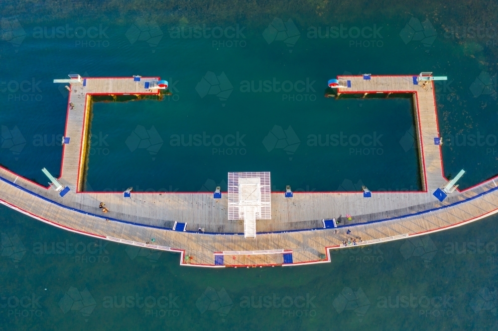 Aerial view of a large diving platform above a circular swimming enclosure - Australian Stock Image