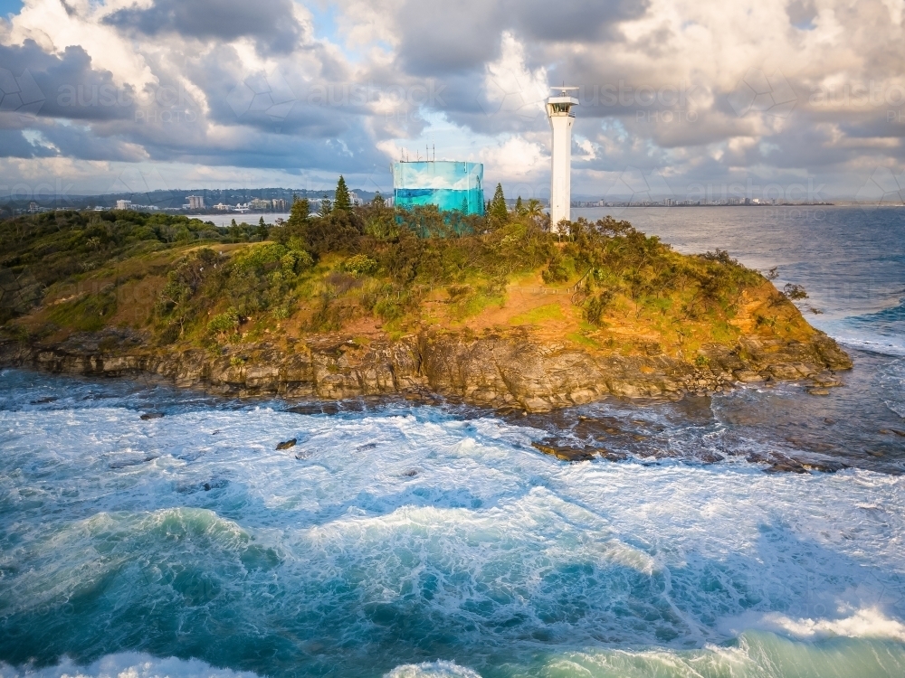 Image of Aerial view of a lighthouse and a water tank on a clifftop ...