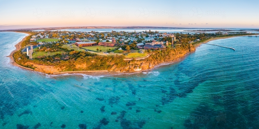 Aerial view of a peninsula jutting out to sea in morning sunshine - Australian Stock Image