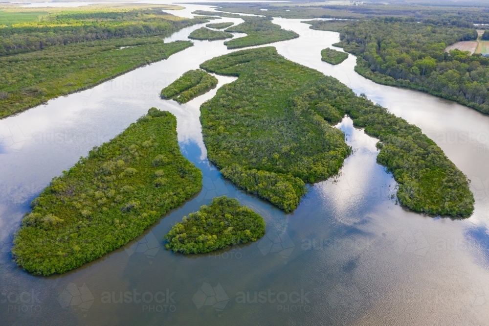 Aerial view of a river system with many islands and lush green vegetation covering its banks - Australian Stock Image