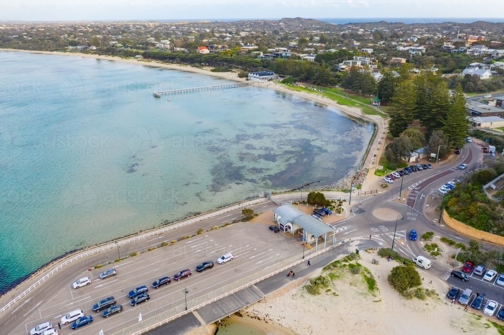 Aerial view of a roundabout with cars lining up at a ferry terminal - Australian Stock Image