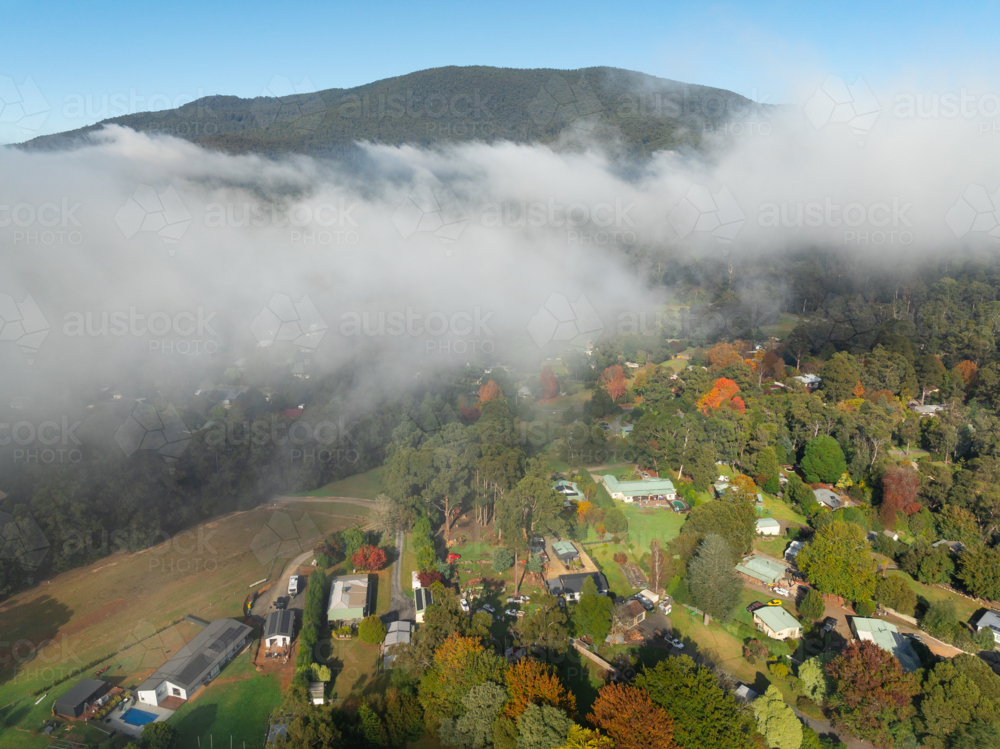 Image of Aerial view of a rural town in a mountain valley with ...