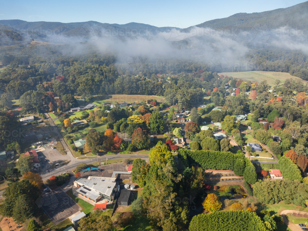 Image of Aerial view of a rural town in a mountain valley with ...