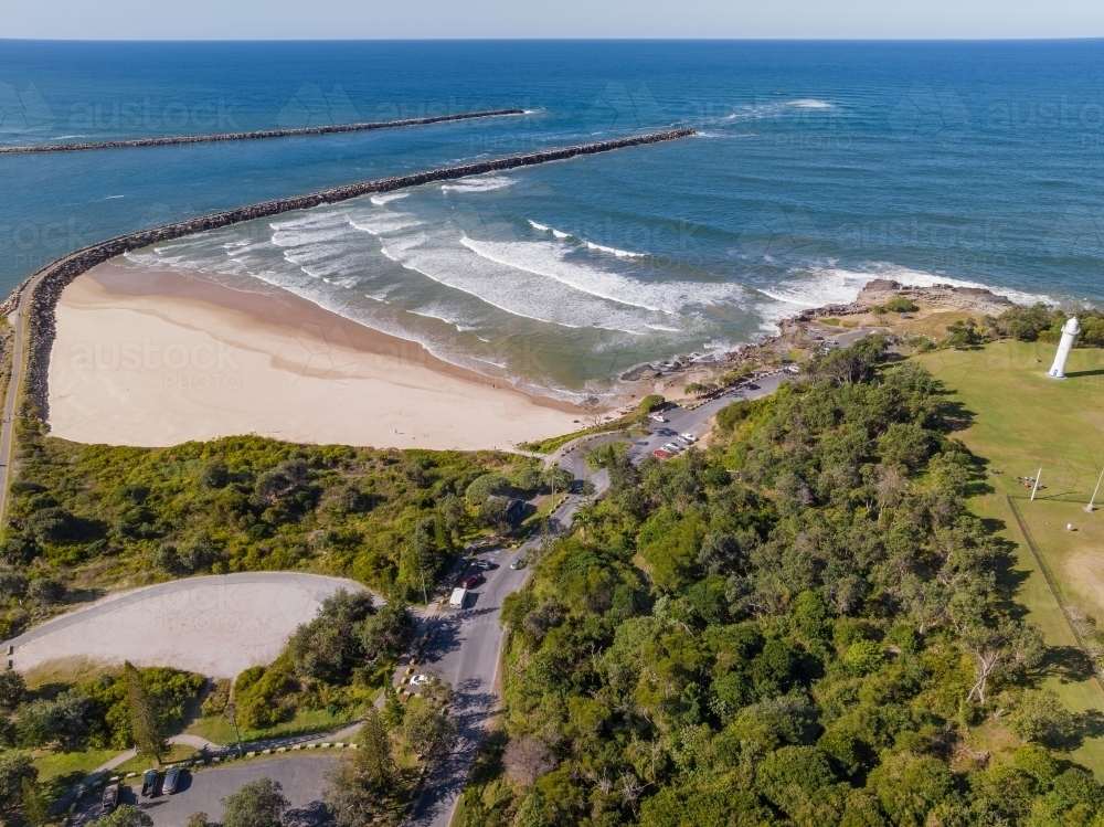 Image of Aerial view of a sandy beach alongside a wide river flowing ...
