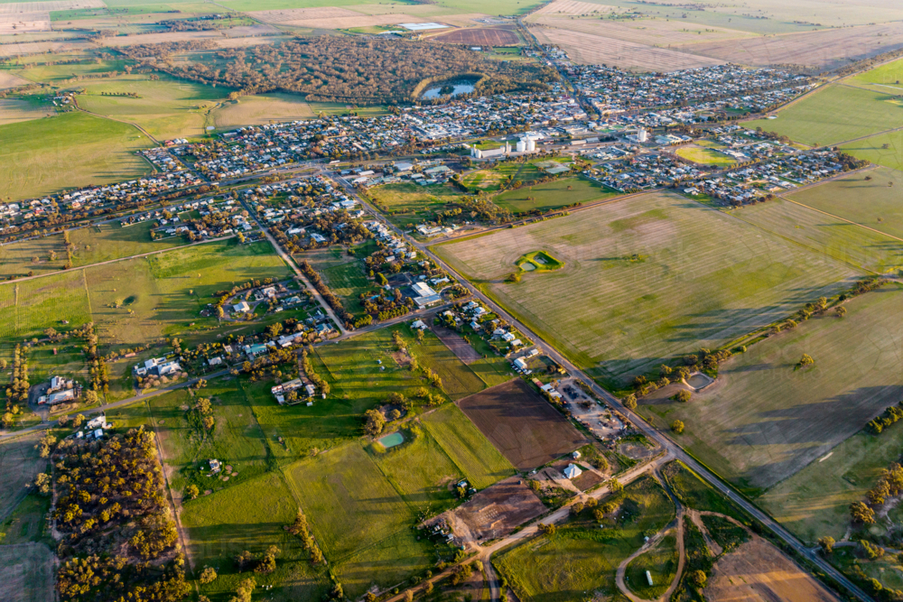 Aerial view of a small country town at golden hour - Australian Stock Image