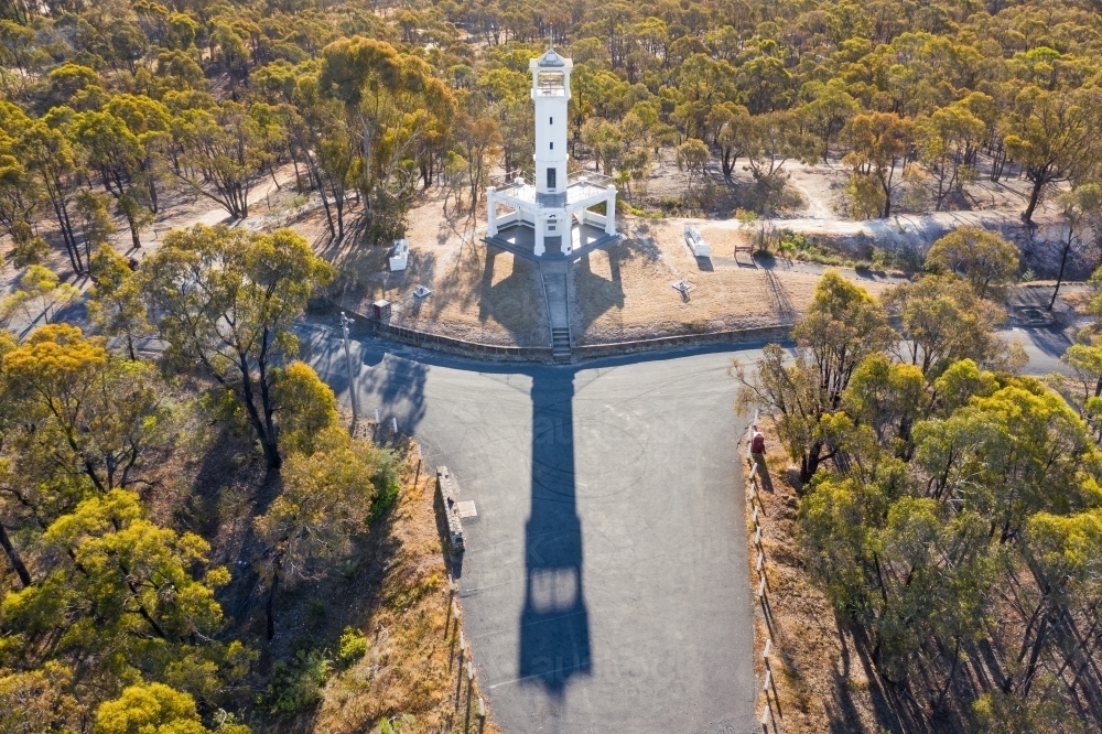 Aerial view of a white lookout tower on a hill top - Australian Stock Image
