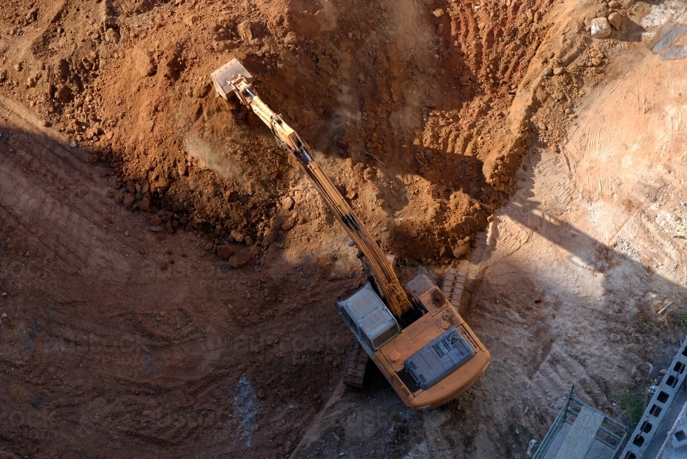 Aerial view of an earth mover in operation on a building site - Australian Stock Image