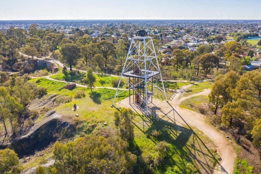 Aerial view of an historic mining poppet head on a hill top surrounded by walking tracks - Australian Stock Image