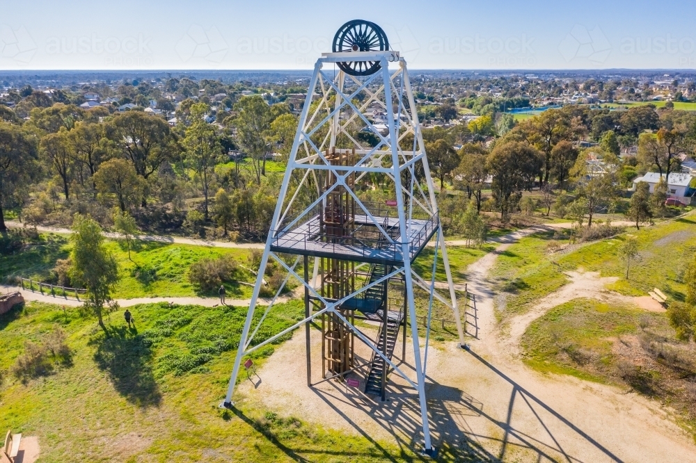 Aerial view of an historic mining poppet head on a hill top surrounded by walking tracks - Australian Stock Image