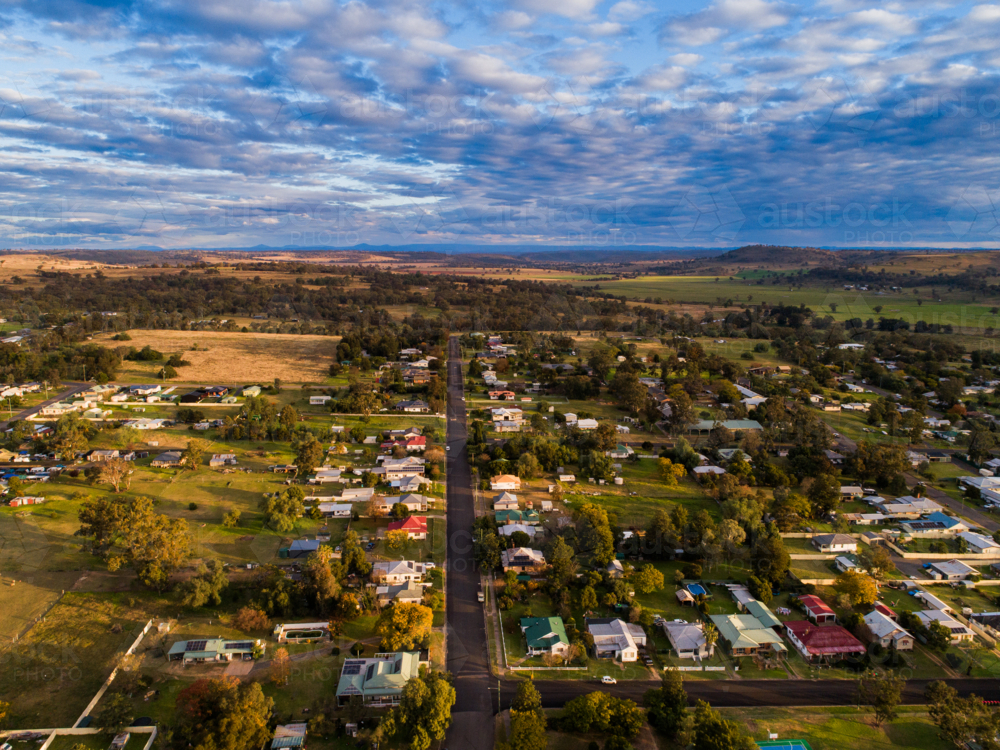 Aerial view of Australian country town of Merriwa with houses along streets to farm paddocks on hori - Australian Stock Image