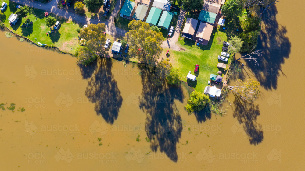 Caravan View Image of Aerial view of awnings and caravans at a tourist park along ...