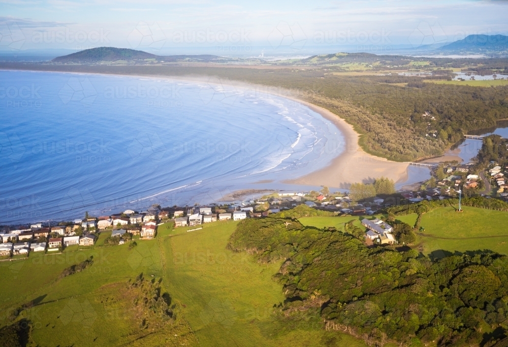 Aerial view of beach and coastal town - Australian Stock Image