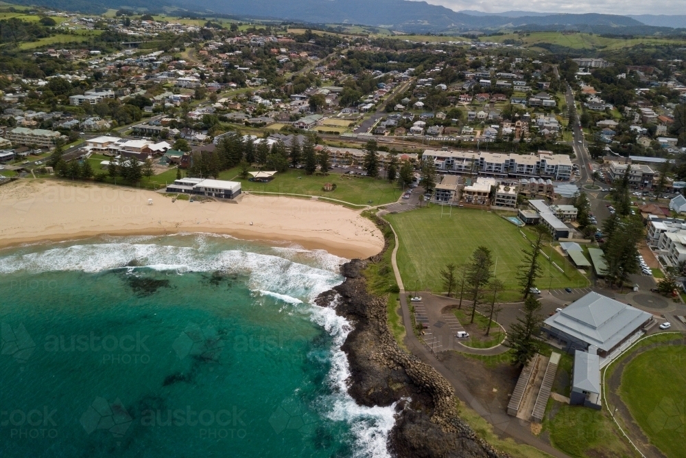 Aerial view of beach, coastal town and sporting field - Australian Stock Image