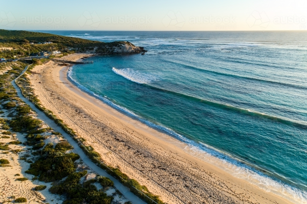 Aerial view of beach, headland, and ocean - Australian Stock Image