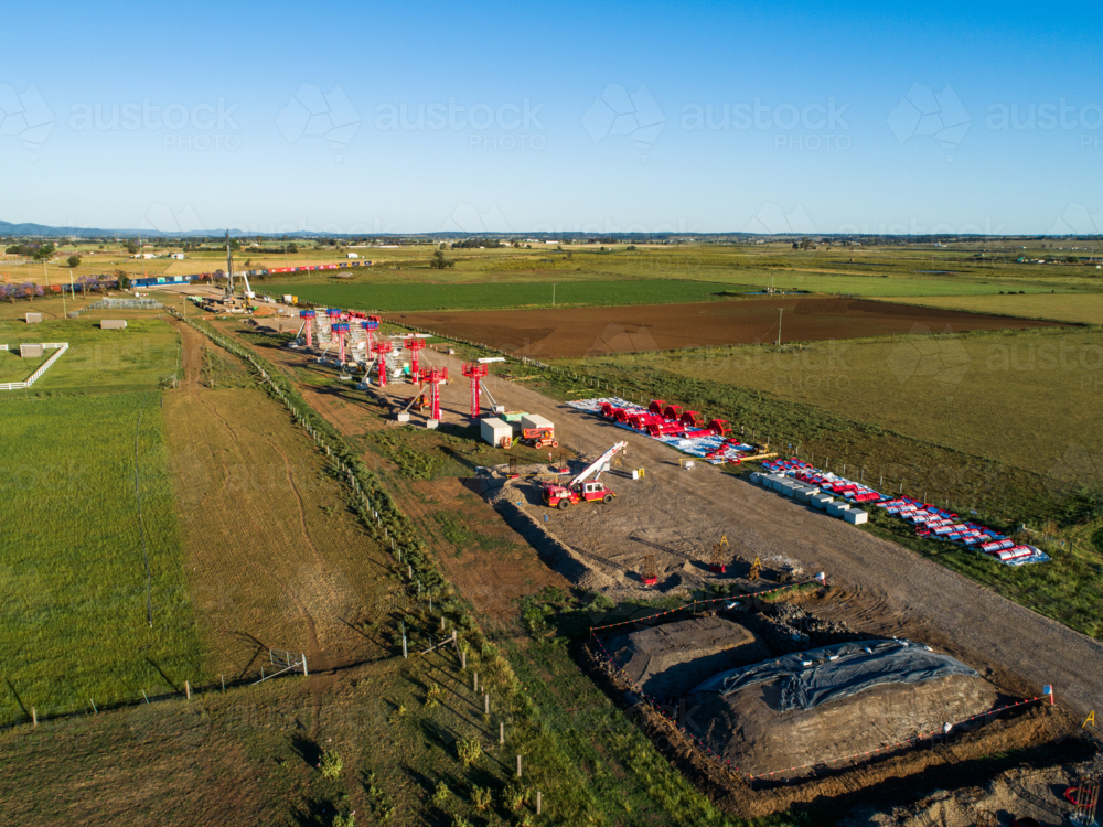 Aerial view of beginnings of bypass highway road under construction in farmland - Australian Stock Image