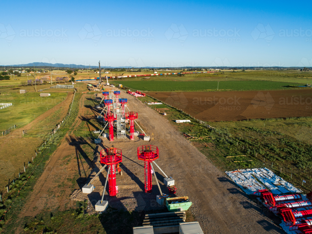 Aerial view of beginnings of bypass highway road under construction in farmland - Australian Stock Image