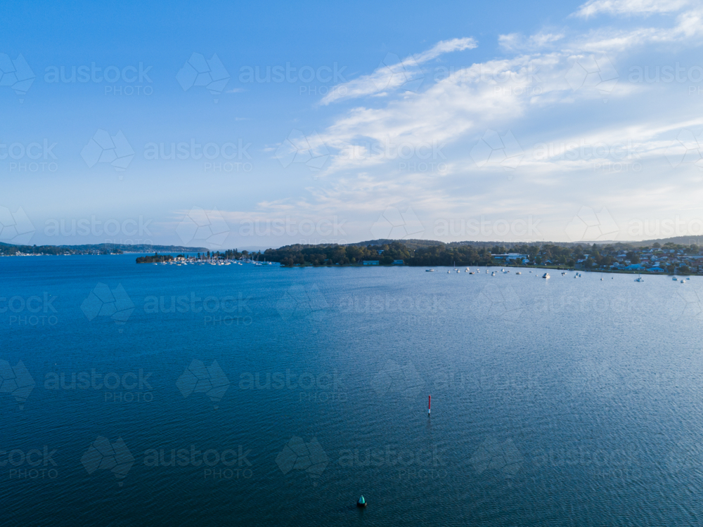 Image of Aerial view of blue water, boats and yachts moored on distant ...